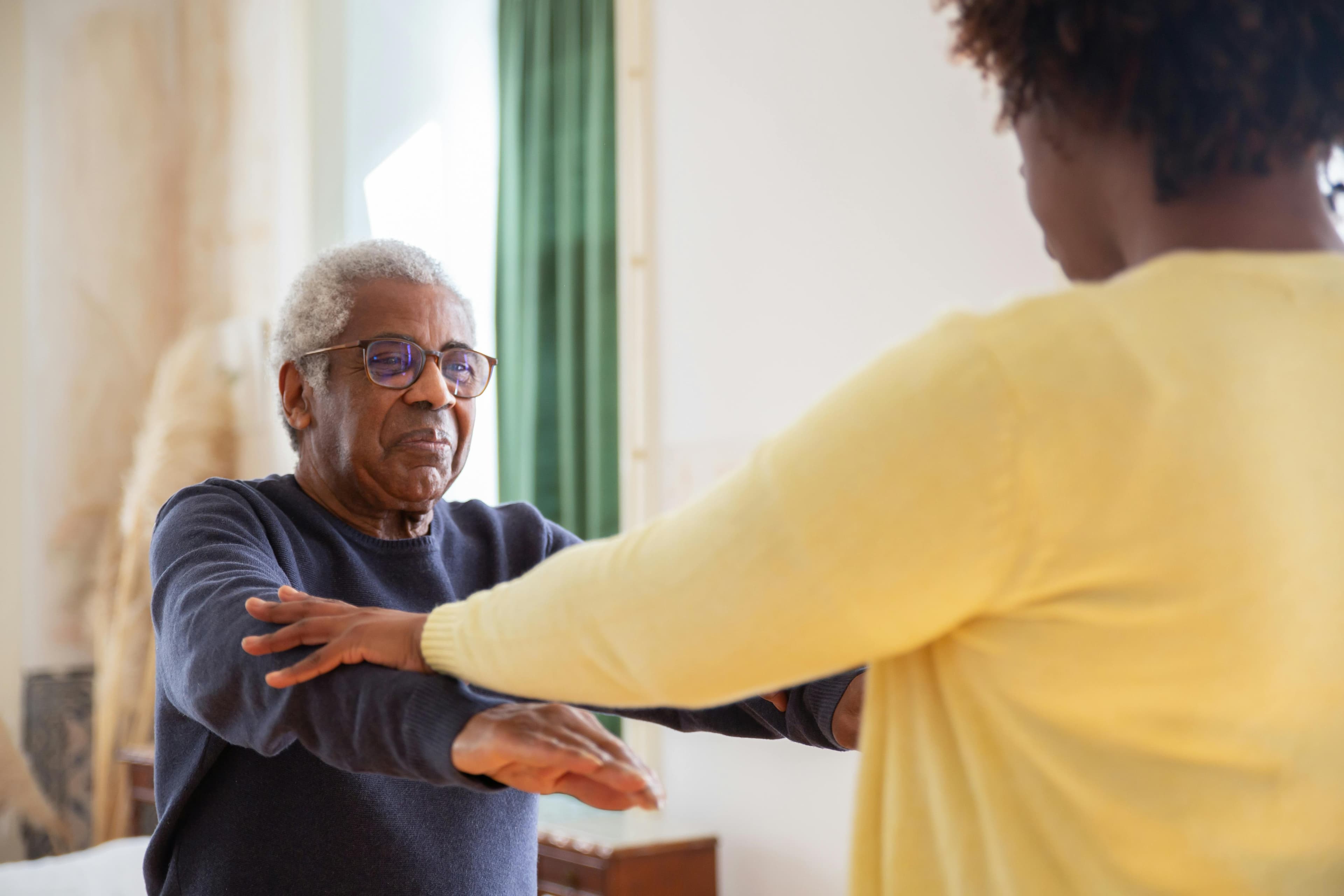 Professional caregiver with senior patient