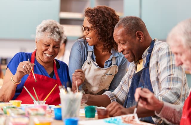 Group of seniors enjoying activities in comfortable care facility